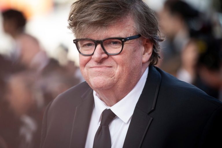 Michael Moore issued a declaration of grievances against the United States in a July 4, 2022 post to Substack. Pictured here, the filmmaker poses for photographers upon arrival at the 2019 international film festival in Cannes, France. 