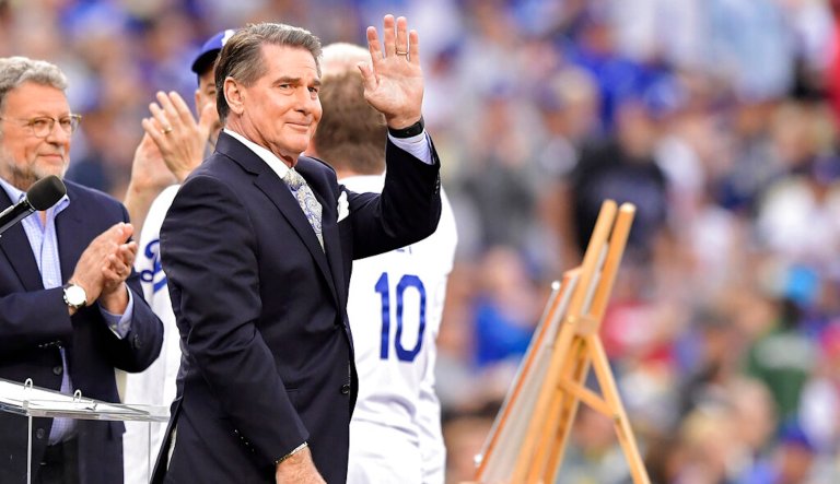 Former Los Angeles Dodger Steve Garvey waves to fans as he is inducted into the Legends of Dodger Baseball prior to a baseball game between the Dodgers and the Philadelphia Phillies on Saturday, June 1, 2019, in Los Angeles.