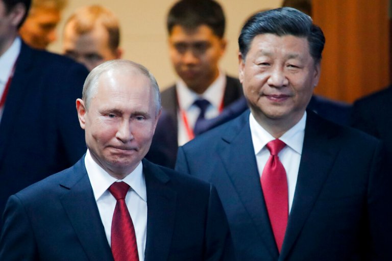 Russian President Vladimir, left, and Chinese President Xi Jinping arrive to attend a plenary session at the St. Petersburg International Economic Forum in St. Petersburg, Russia, Friday, June 7, 2019.