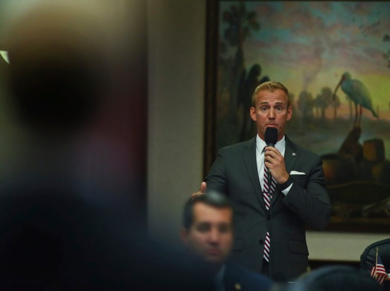 At right, Rep. Michael Grieco, D-Miami Beach, asks a question to Rep. James Grant, R-Tampa, left, during debate over Grant's House Bill 7089 - Voting Rights Restoration,Tuesday April 23, 2019 in the Florida House of Representatives in Tallahassee, Fla. (AP Photo/Phil Sears)