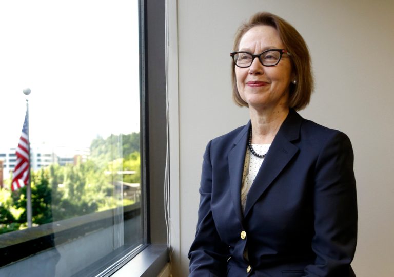 FILE - In this July 13, 2016 file photo, Oregon Attorney General Ellen Rosenblum poses for a photo at her office in Portland, Ore.  (AP Photo/Don Ryan, File)