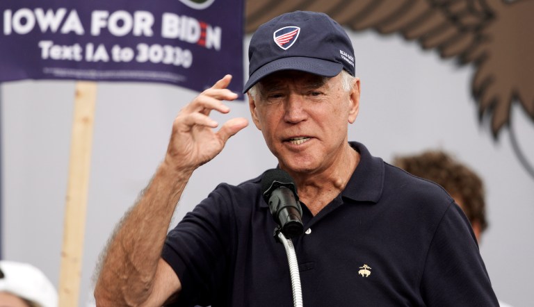Then-Democratic presidential candidate Joe Biden puts on a Beau Biden Foundation hat while speaking at the Polk County Democrats Steak Fry, in Des Moines, Iowa, Saturday, Sept. 21, 2019. (AP Photo/Nati Harnik)