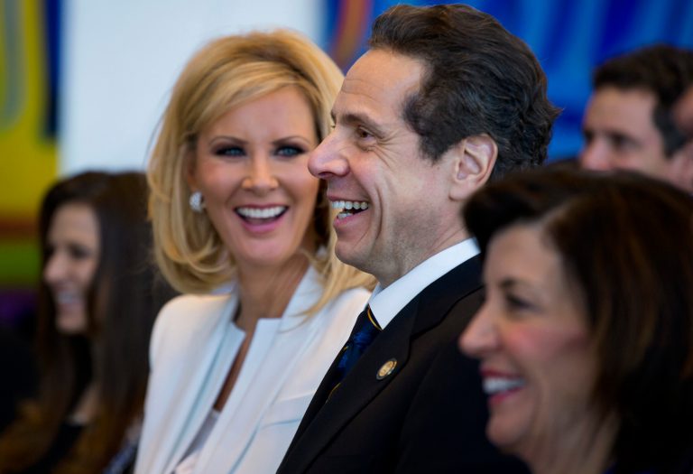 In this Jan. 1, 2015 file photo, New York Gov. Andrew Cuomo and his former girlfriend Sandra Lee smile during an inaugural ceremony at One World Trade Center in New York. The couple have announced their break up after more than a decade together. Cuomo and Lee said in a statement Wednesday, Sept. 25, 2019, that their lives have gone in different directions but that they remain close friends.