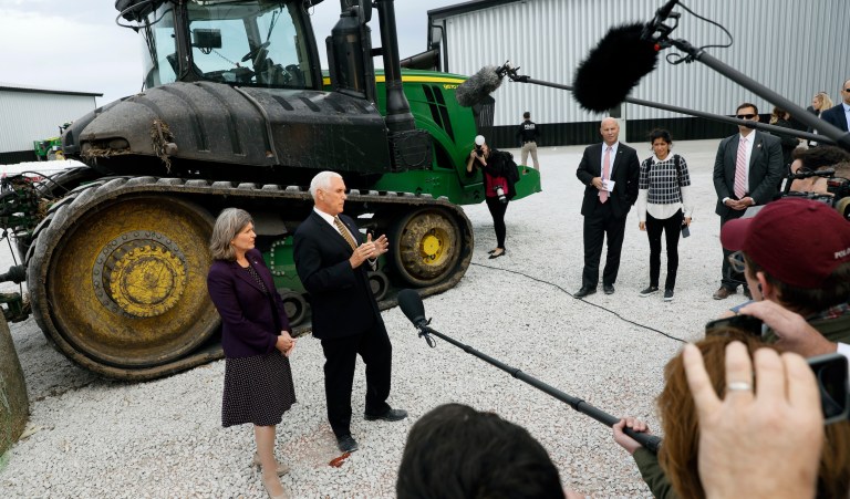 Vice President Mike Pence and Sen. Joni Ernst, R-Iowa, speak to reporters during a previous trip to Iowa earlier in October.