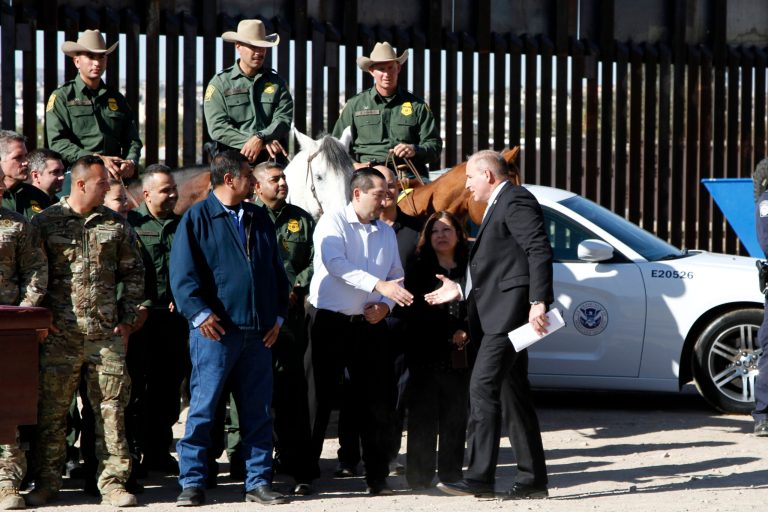Former Customs and Border Protection Acting Commissioner Mark Morgan shakes hands with members of his staff ahead of a news conference near the U.S.-Mexico border on Tuesday, Oct. 29, 2019, in El Paso, Texas.