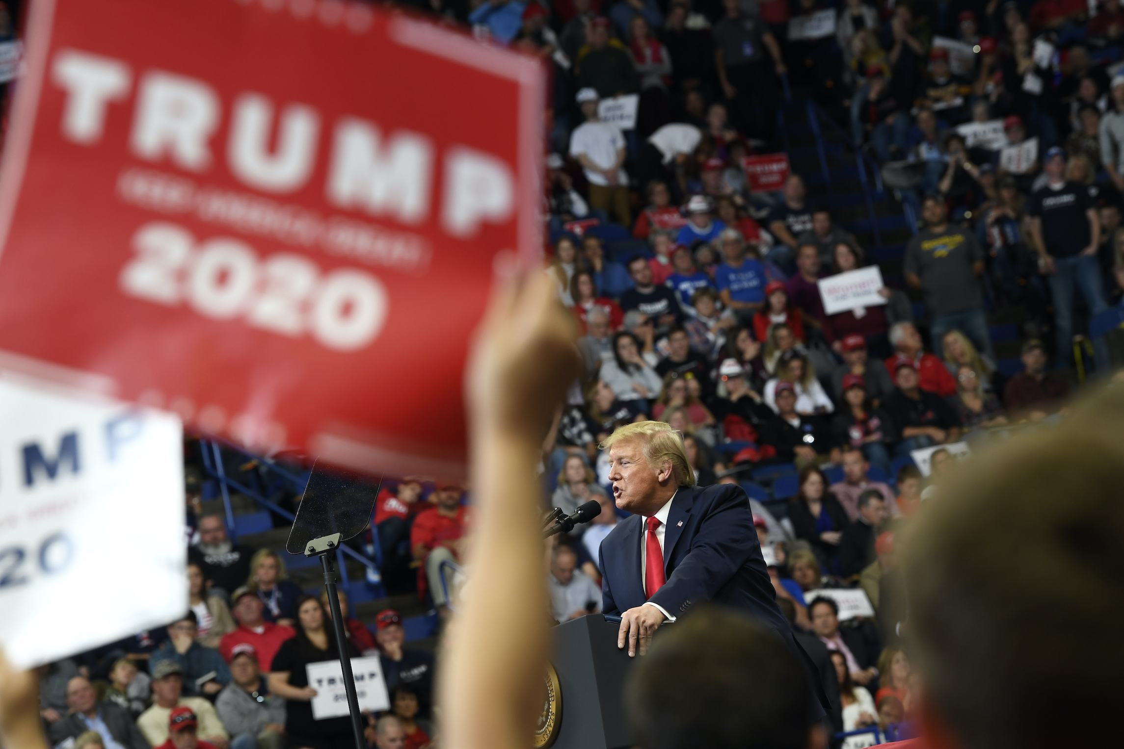 Trump urgently seeks to reverse a tough week with an exuberant rally