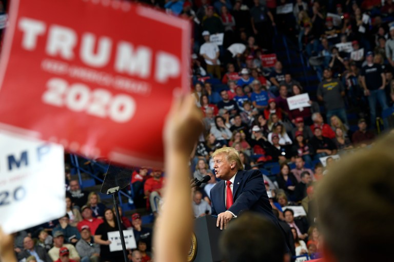 Trump urgently seeks to reverse a tough week with an exuberant rally