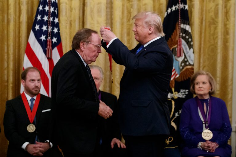 President Donald Trump presents a National Humanities Medal to author and friend James Patterson during a National Medal of Arts and National Humanities Medal ceremony in the East Room of the White House, Thursday, Nov. 21, 2019.