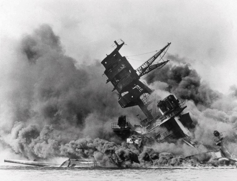 In this Dec. 7, 1941, file photo, smoke rises from the battleship USS Arizona as it sinks during the Japanese attack on Pearl Harbor, Hawaii. A new report warns of China launching an electronic 'Pearl Harbor' attack.