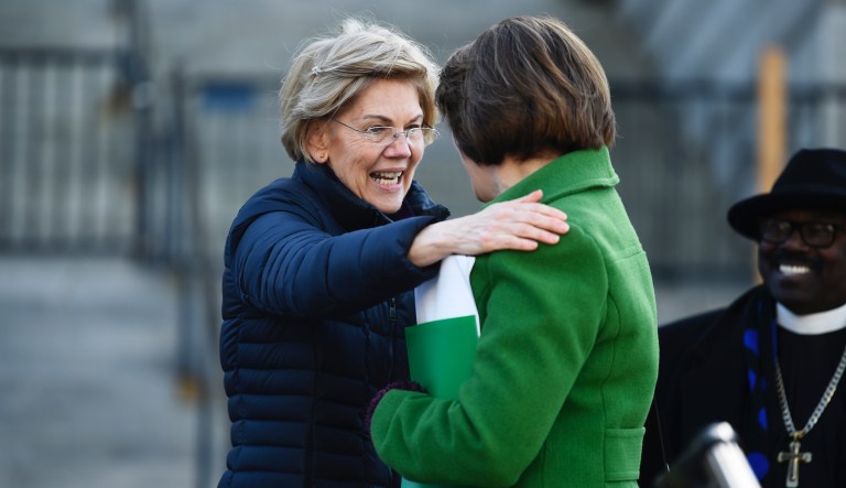 Democratic presidential rivals Elizabeth Warren and Amy Klobuchar say goodbye to each other after Warren's speech at a Martin Luther King Jr. Day rally on Monday, Jan. 20, 2020, in Columbia, S.C.