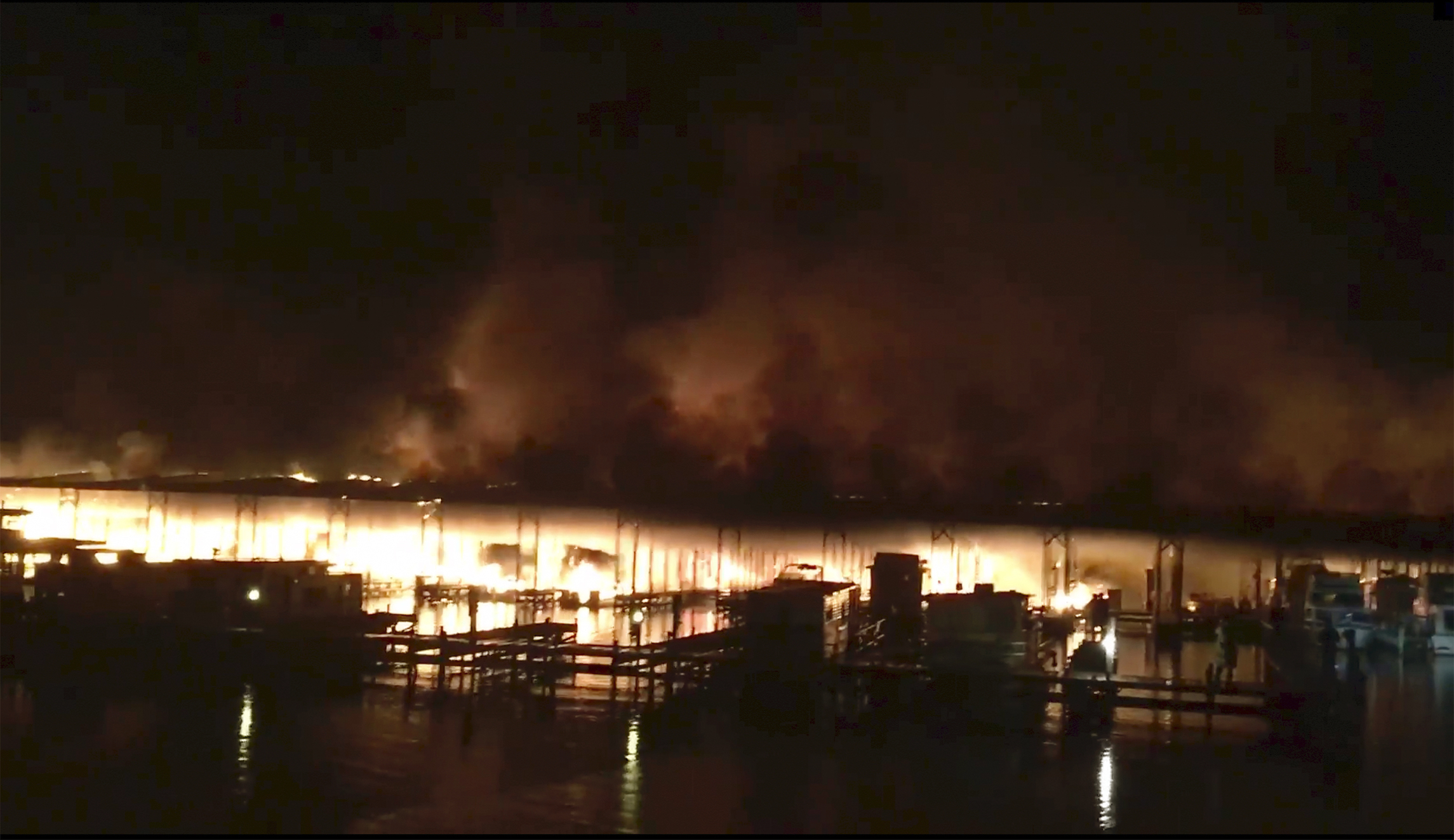Alabama boathouse fire leaves nine missing and dozens of boats destroyed