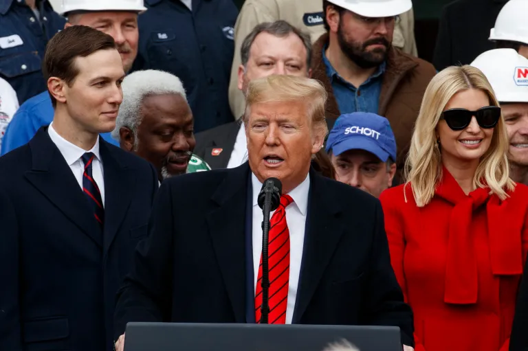 Former President Donald Trump speaks, accompanied by  Jared Kushner, left, and Ivanka Trump, his daughter and assistant to President Donald Trump, during an event at the White House to sign a new North American trade agreement with Canada and Mexico, Wednesday, Jan. 29, 2020. All three did not take pay.