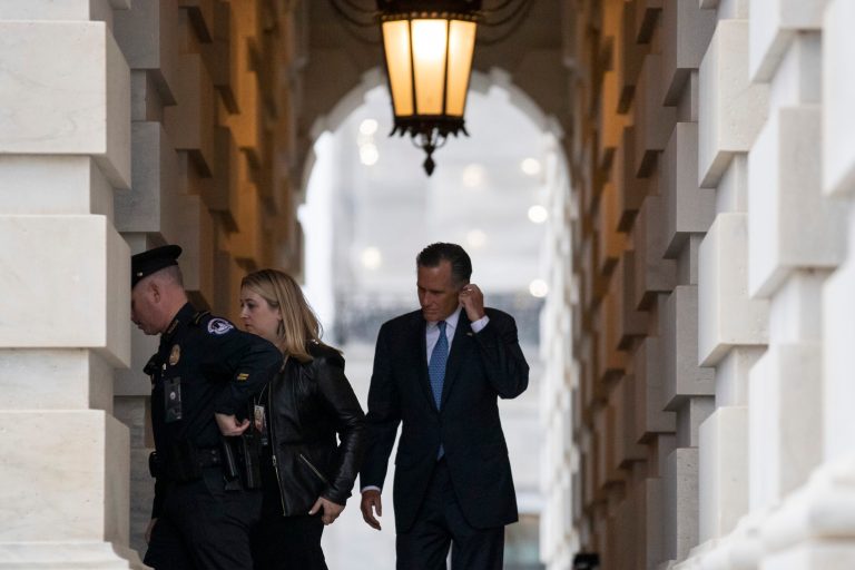 Sen. Mitt Romney, R-Utah, right, departs after the impeachment acquittal of President Trump, on Capitol Hill, Wednesday, Feb. 5, 2020 in Washington.