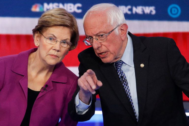 Democratic presidential candidates, Sen. Elizabeth Warren, D-Mass., left, and Sen. Bernie Sanders, I-Vt., talk during a Democratic presidential primary debate Wednesday, Feb. 19, 2020, in Las Vegas. A new poll said they could win the White House.