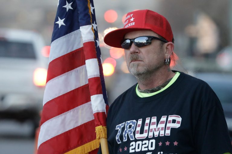 A Trump supporter protests outside a rally for Democratic presidential candidate Mike Bloomberg Thursday in Salt Lake City.