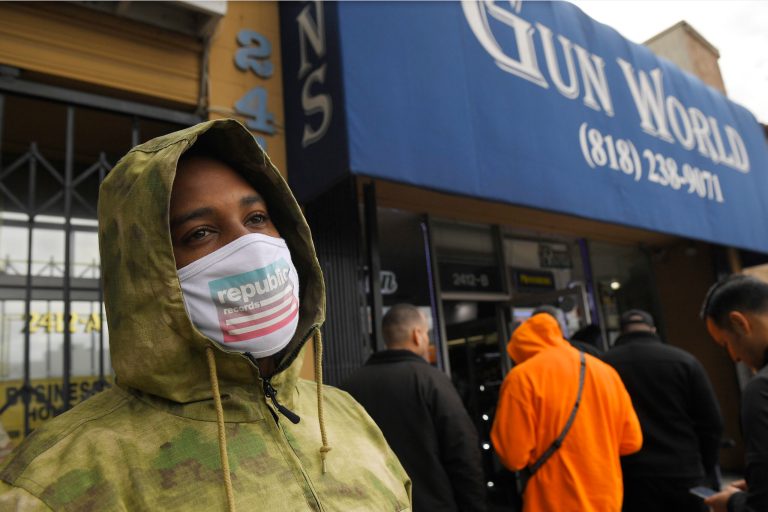 A gun store customer that gave his name only at John waits in line last week in Burbank, Calif. As consumers are buying all kinds of goods in large quantities amid coronavirus concerns, putting pressure on inventories.