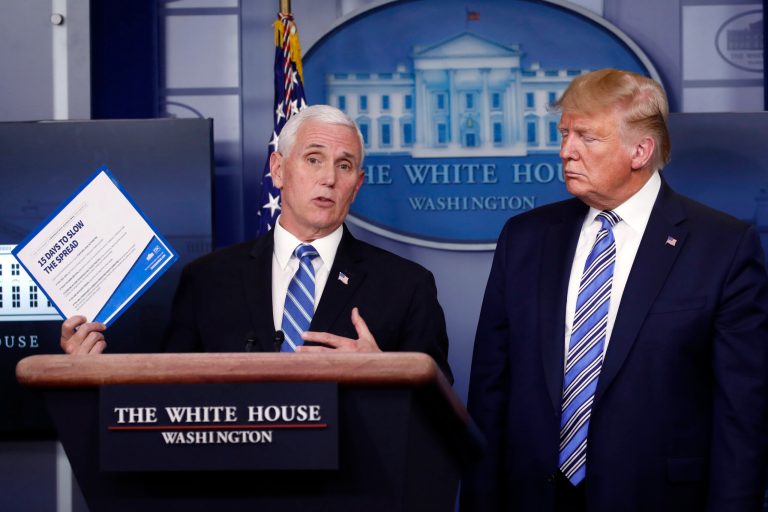 President Donald Trump listens as Vice President Mike Pence speaks about the coronavirus in the James Brady Briefing Room, Monday, March 23, 2020, in Washington.