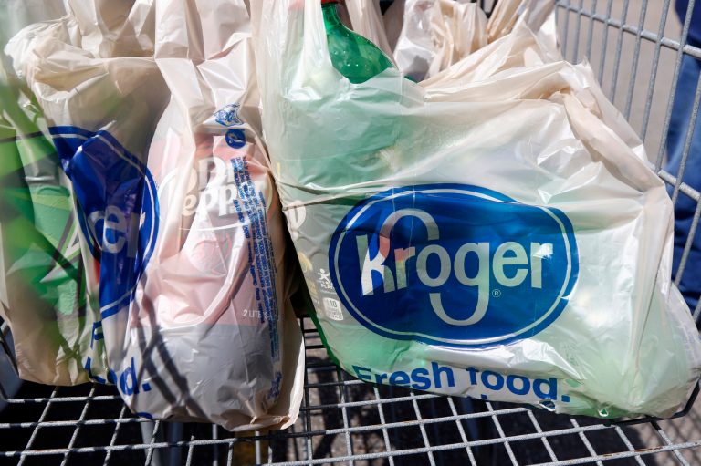 FILE - In this June 15, 2017, file photo, bagged purchases from the Kroger grocery store in Flowood, Miss., sit inside this shopping cart.