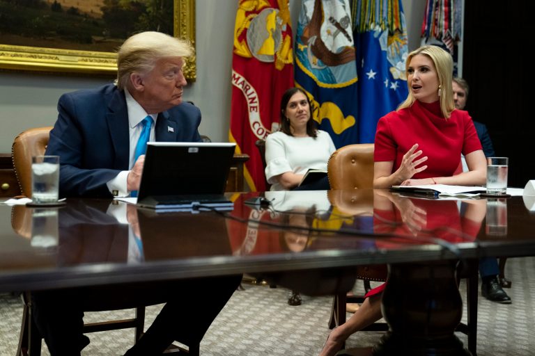 President Donald Trump listens as Ivanka Trump speaks during a conference call with banks on efforts to help small businesses during the coronavirus pandemic Tuesday.
