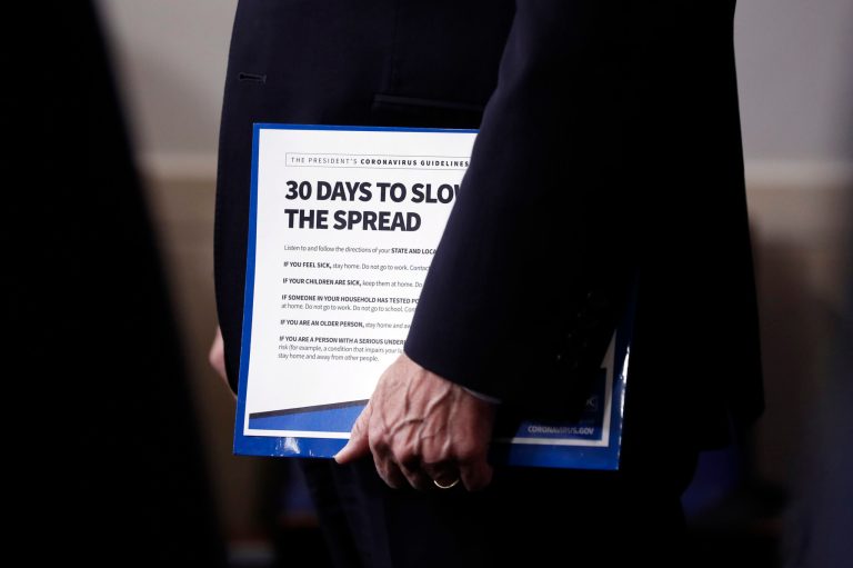 Vice President Mike Pence holds his notes in an April coronavirus task force meeting.