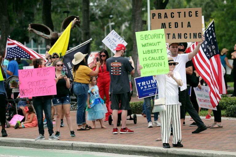Protesters demanding Florida businesses and government reopen. Small-government groups, supporters of President Donald Trump, anti-vaccine advocates, have a suspicion of efforts to shut down daily life to slow the spread of the coronavirus.