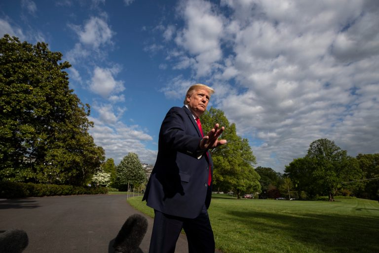 President Donald Trump waves as he departs the White House Friday for Camp David.