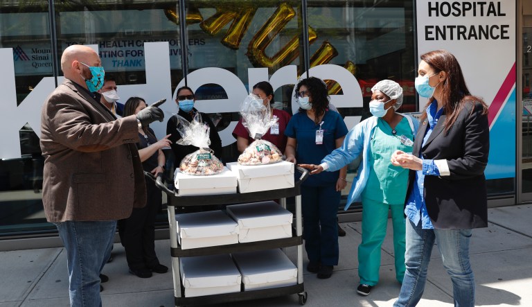 Governors juggle new restrictions with reopenings as coronavirus cases surge