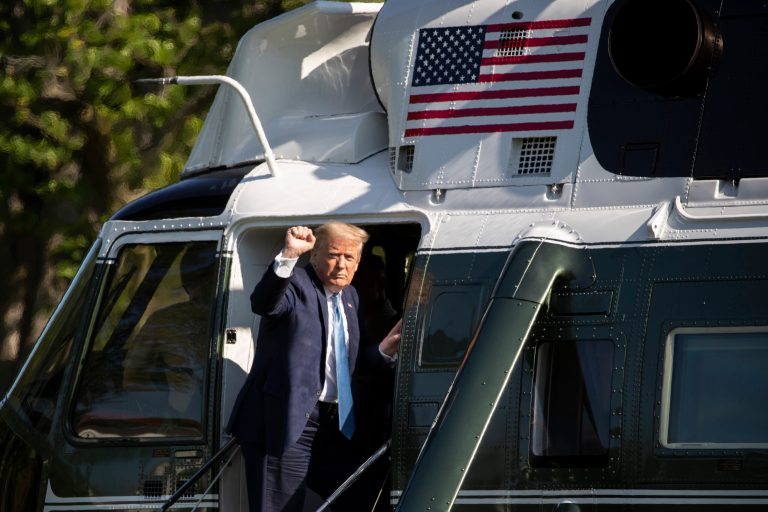 President Donald Trump pumps his fist as he departs the White House on Marine One, Friday, May 15, 2020, in Washington. Trump is en route to Camp David, Md.