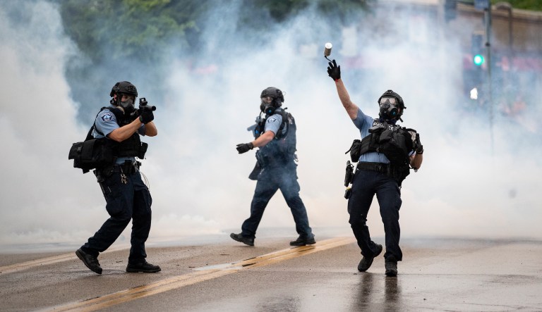 Protesters in Minneapolis clash with police after death of black man officers had pinned down