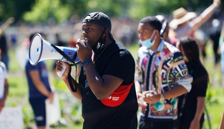 Tay Anderson, Denver School Board at-large director, leads demonstrators during a march calling for more oversight of the police Sunday, June 7, 2020, in Denver.