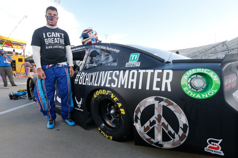 Driver Bubba Wallace waits for the start of a NASCAR Cup Series auto race Wednesday, June 10, 2020, in Martinsville, Va.