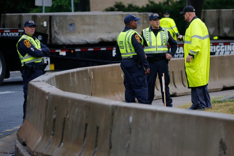State and Capitol police patrol the area where workers for The Virginia Department of General Services are installing concrete barriers around the statue of Confederate General Robert E. Lee on Monument Avenue Wednesday, June 17, 2020, in Richmond, Va. The barriers are intended to protect the safety of demonstrators as well as the structure itself.