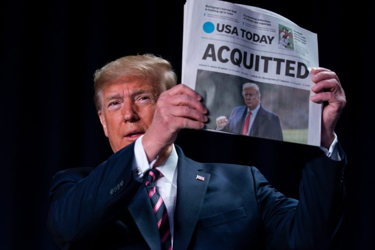 FILE - In this Feb. 6, 2020, file photo, President Donald Trump holds up a newspaper with the headline that reads "ACQUITTED" at the 68th annual National Prayer Breakfast, at the Washington Hilton in Washington. Pew finds that just 3% get their political news from print.