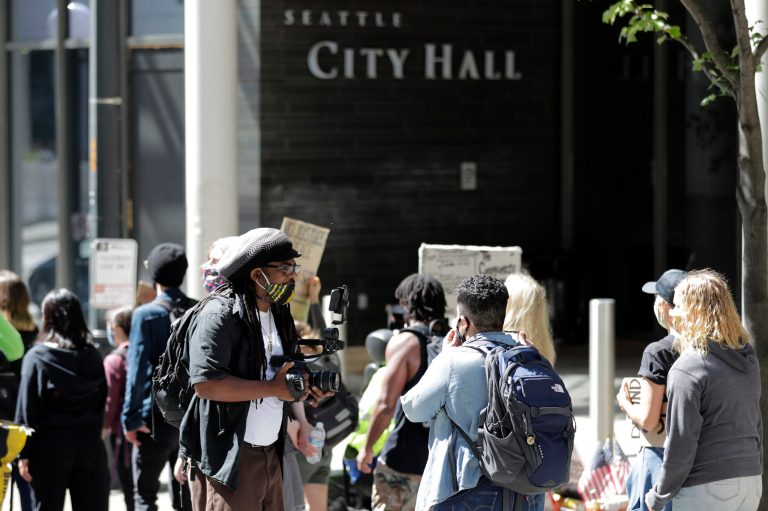 Seattle City Council advances cuts to police but they fall short of activists’ rallying cries