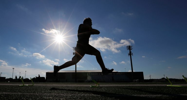 A student athlete runs a drill during a strength and conditioning camp at Arlington Martin High School Thursday, June 18, 2020, in Arlington, Texas.