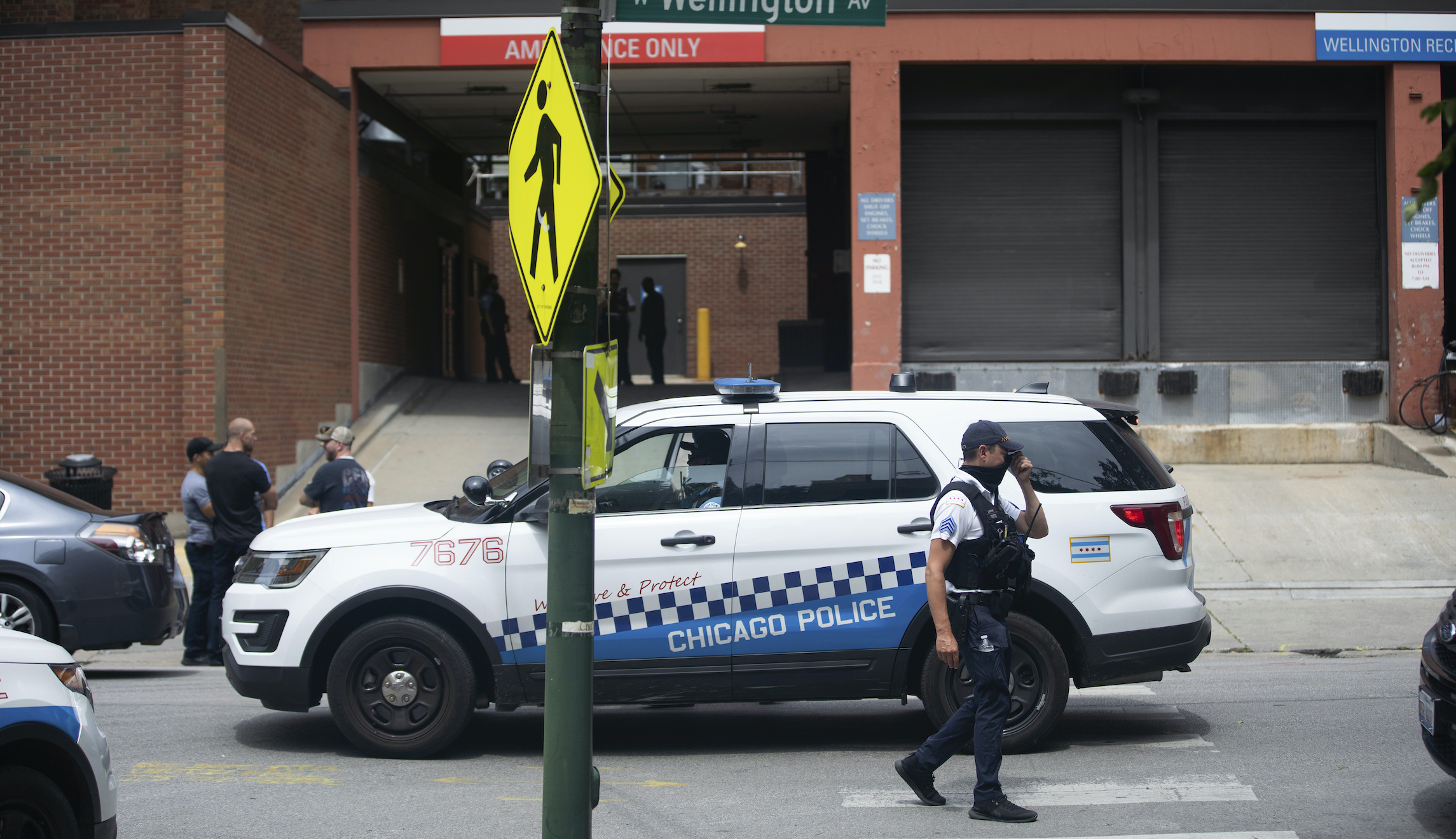 Three officers shot outside Chicago police station while making arrest