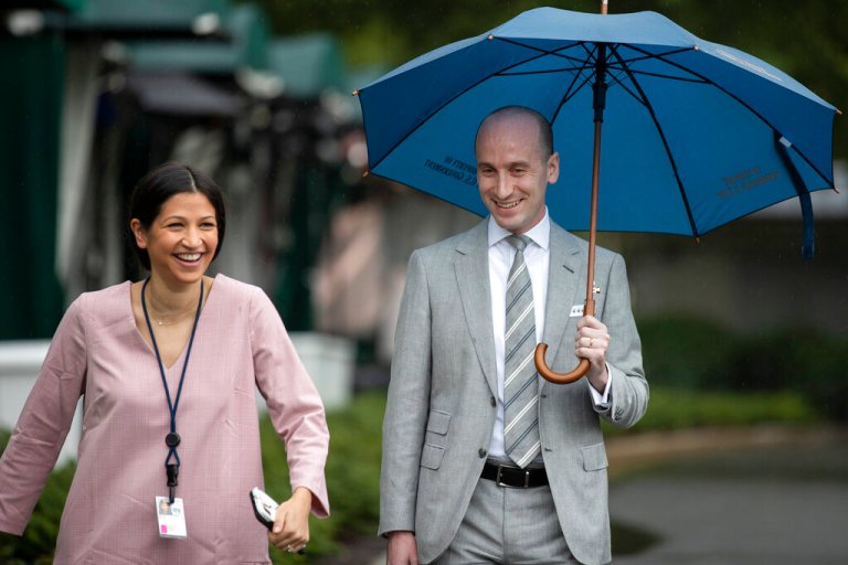 Vice President Mike Pence's communications director Katie Miller, and her husband White House senior adviser Stephen Miller smile as they walk past reporters at the White House, Friday, July 31, 2020, in Washington. Married less than a year, they announced the birth of their daughter today.
