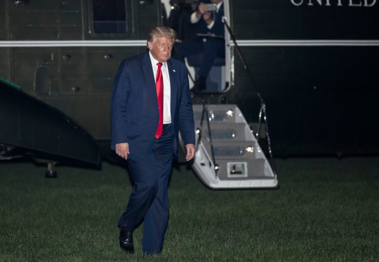 President Donald Trump walks from Marine One on the South Lawn of the White House  Friday after returning from Florida.
