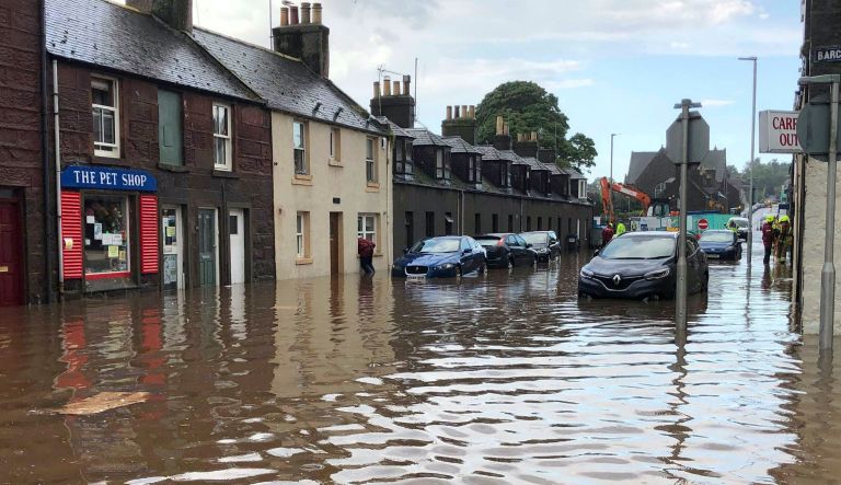 Many feared injured after train derails near flooded town in Scotland