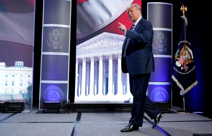 President Donald Trump arrives to speak to the 2020 Council for National Policy Meeting in Arlington, Va. 