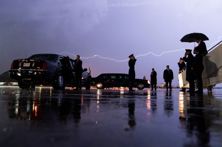 A lightning strike moves across the sky as President Donald Trump arrives at Andrews Air Force Base, Md.,. during a storm after attending a campaign rally, Friday, Aug. 28, 2020.