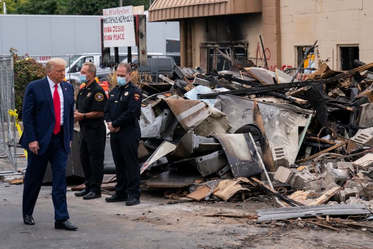 President Donald Trump tours an area on Tuesday, Sept. 1, 2020, damaged during demonstrations after a police officer shot Jacob Blake in Kenosha, Wis.