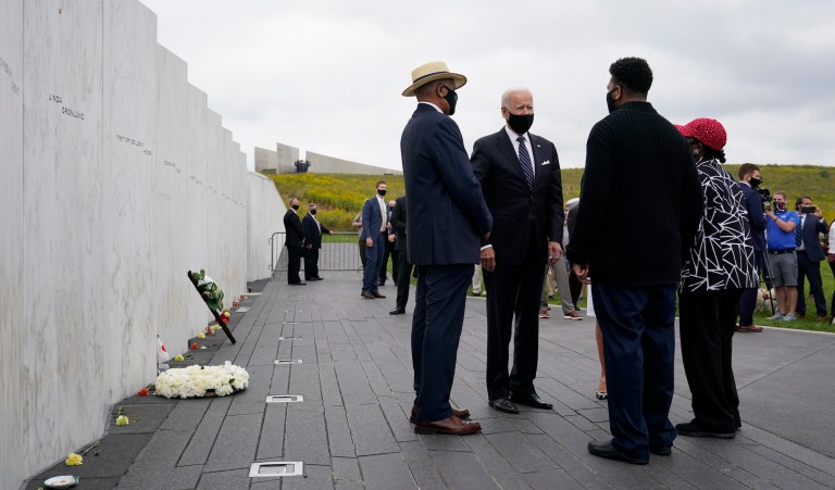 Democratic presidential candidate and former Vice President Joe Biden stands with Calvin Wilson and others as he visits the Flight 93 National Memorial in Shanksville, Pa., Friday, Sept. 11, 2020, to commemorate the 19th anniversary of the Sept. 11 terrorist attacks. Wilson is the brother-in-law of First Officer LeRoy Homer, a passenger on Flight 93.