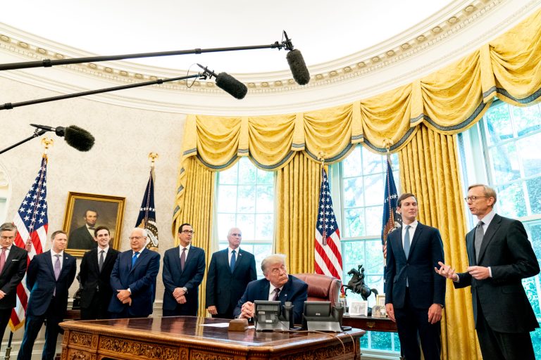 U.S. special envoy for Iran Brian Hook, right, accompanied by from left, Deputy national security adviser Matthew Pottinger, Avraham Berkowitz, Assistant to the President and Special Representative for International Negotiations, U.S. Ambassador to Israel David Friedman, Treasury Secretary Steven Mnuchin, Vice President Mike Pence, Donald Trump, President Donald Trump's White House senior adviser Jared Kushner, speaks in the Oval Office of the White House, Friday, Sept. 11, 2020, in Washington. Bahrain has become the latest Arab nation to agree to normalize ties with Israel as part of a broader diplomatic push by Trump and his administration to fully integrate the Jewish state into the Middle East.
