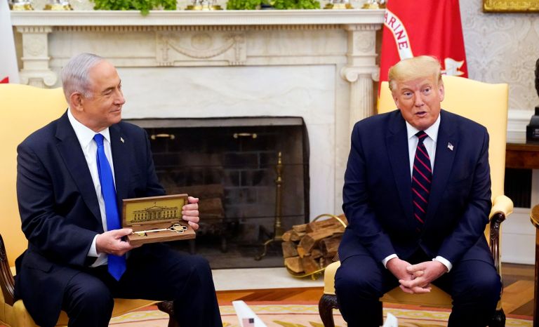 President Donald Trump meets with Israeli Prime Minister Benjamin Netanyahu in the Oval Office at the White House in Washington. Trump presented the key to Netanyahu as a gift.