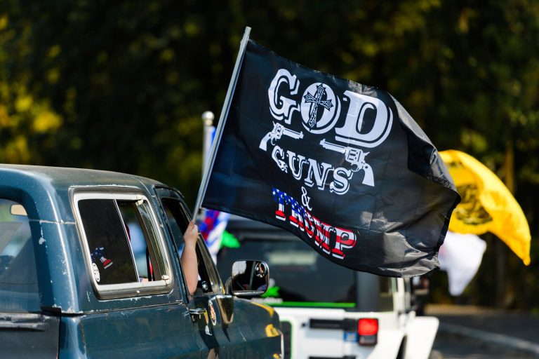 Participants in an "Oregon for Trump 2020 Labor Day Cruise Rally" at Clackamas Community College in Oregon City, Ore. Like in 2016, the election is helping push gun sales and FBI background checks to record levels.
