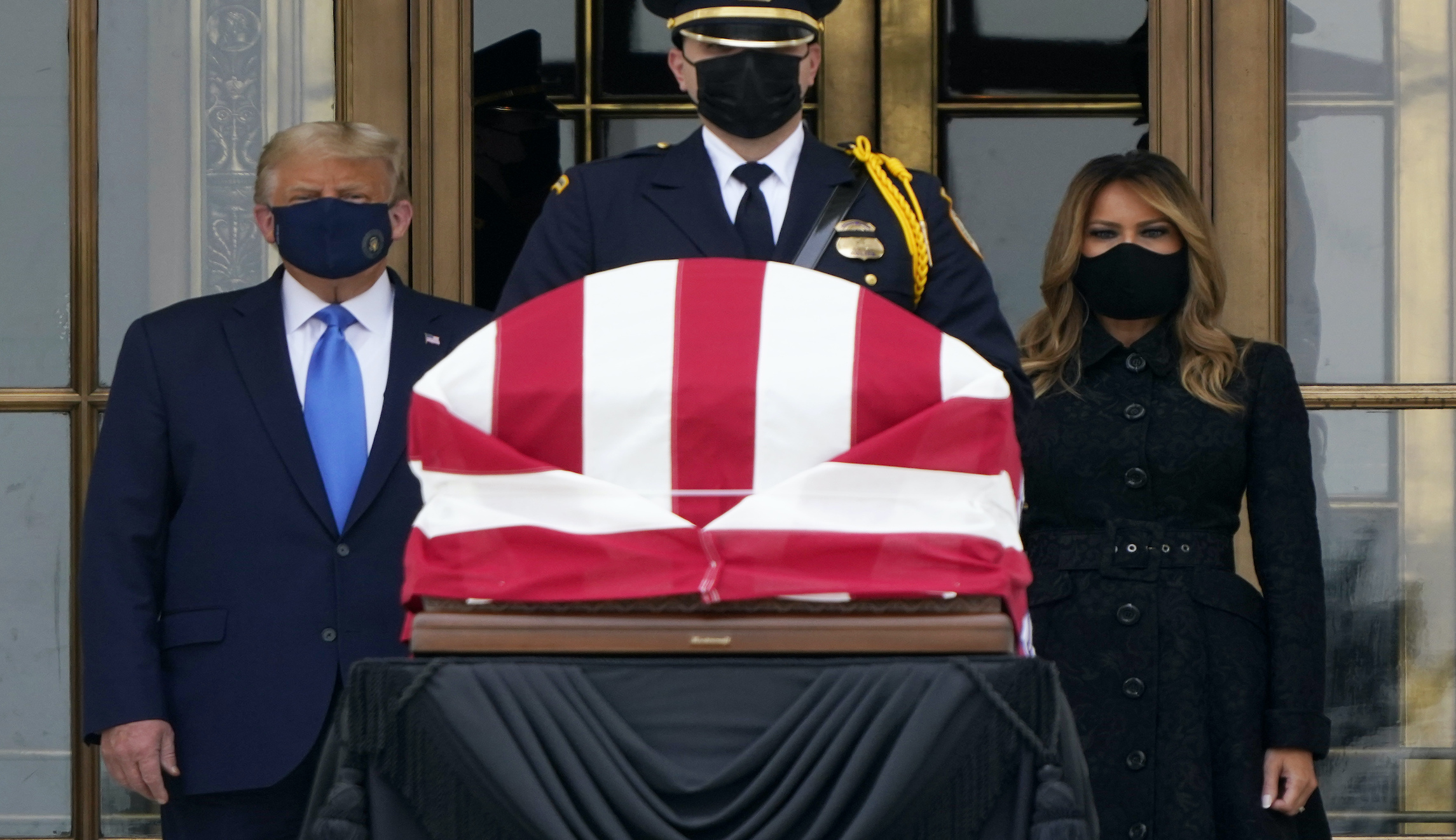 Trump greeted with boos during visit to pay respect to Ruth Bader Ginsburg