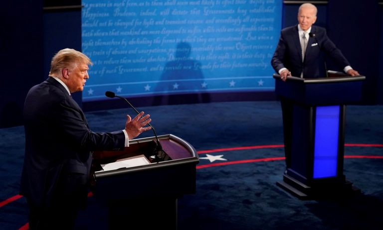 President Donald Trump answers a question as Democratic presidential candidate former Vice President Joe Biden listens during the first presidential debate Tuesday, Sept. 29, 2020, at Case Western University and Cleveland Clinic, in Cleveland, Ohio.