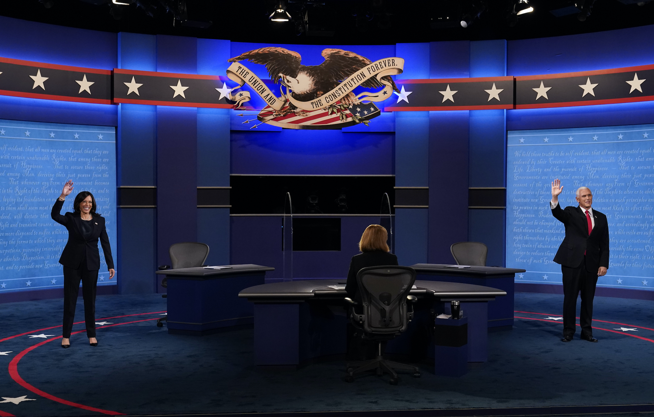 Pence and Harris strike calmer tone than presidential debate but sharply contest the issues