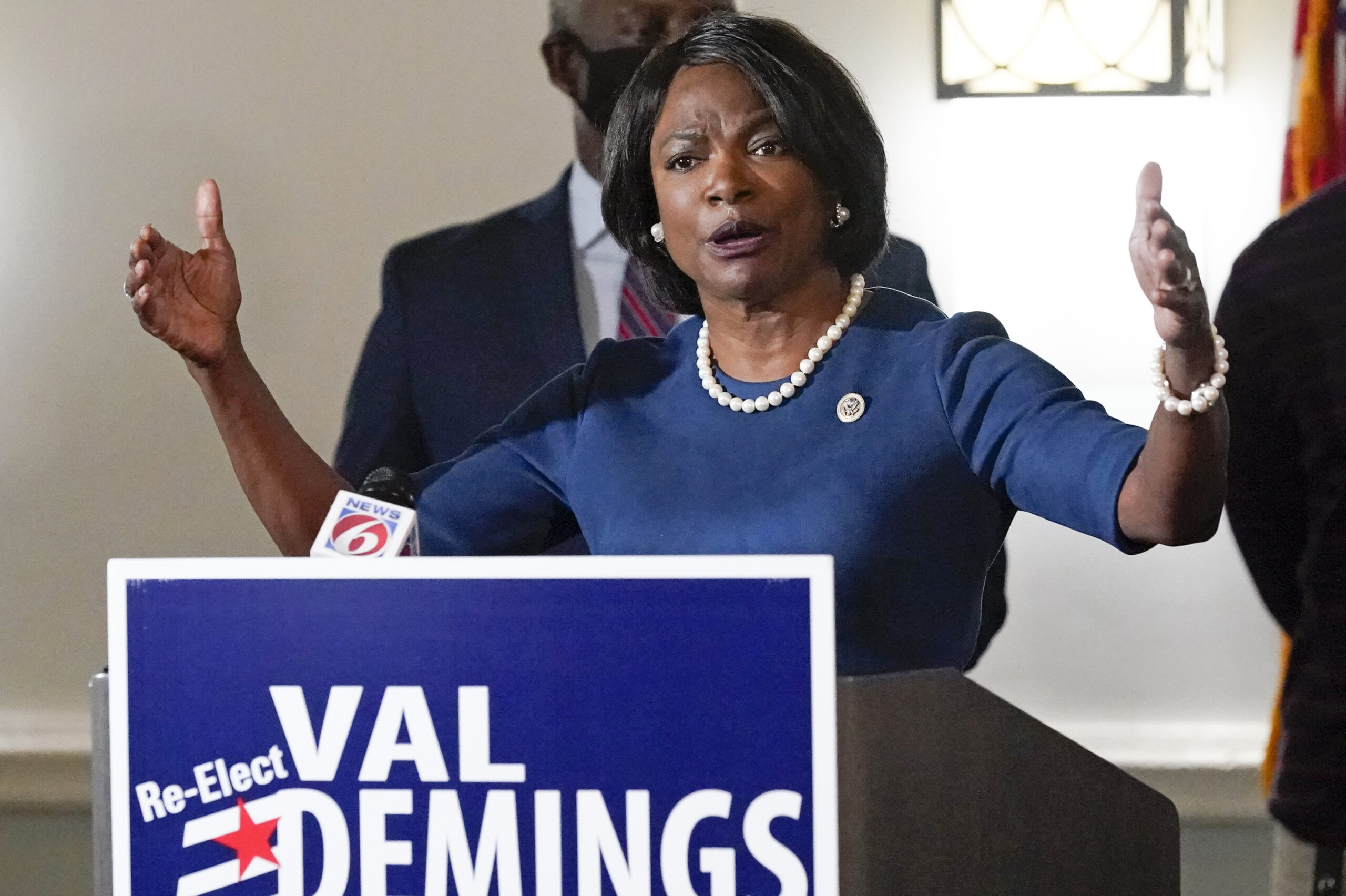 WATCH: Val Demings security team pushes video tracker to the ground